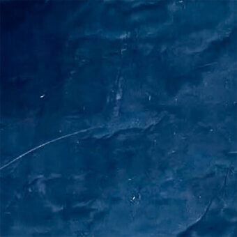 Blue fabric laminate texture with rippling effect and white highlights, displaying a smooth, uneven surface with subtle linear markings.